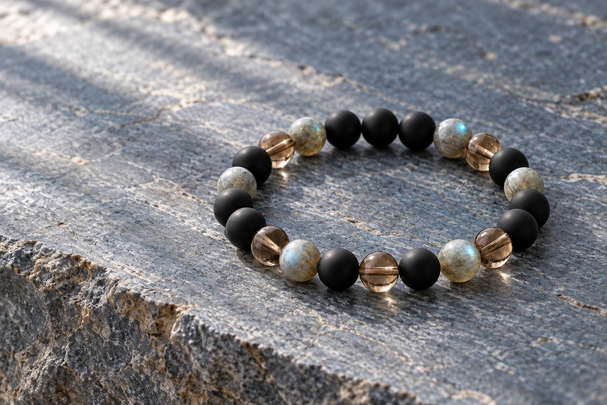 Onyx, labradorite and smoky quartz bracelet on grey stone