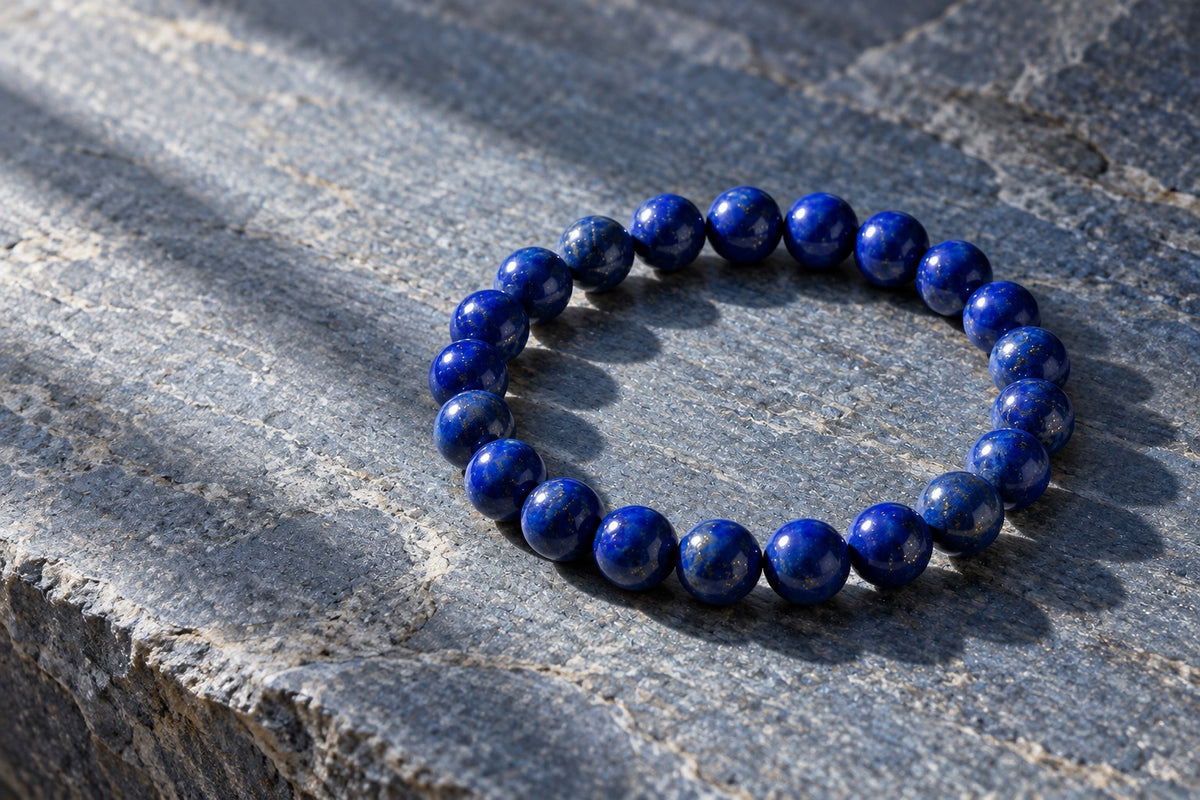 Lapis lazuli bead bracelet on grey stone