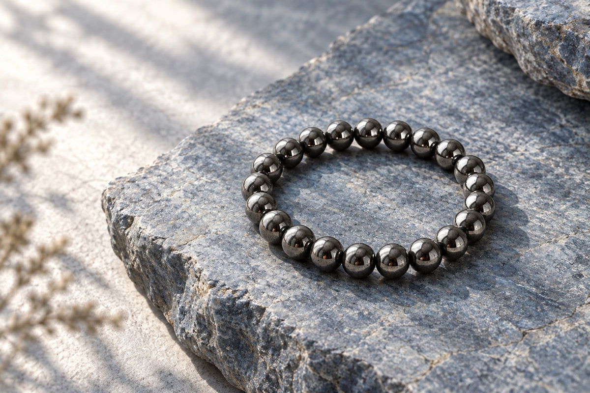Hematite bead bracelet on grey stone