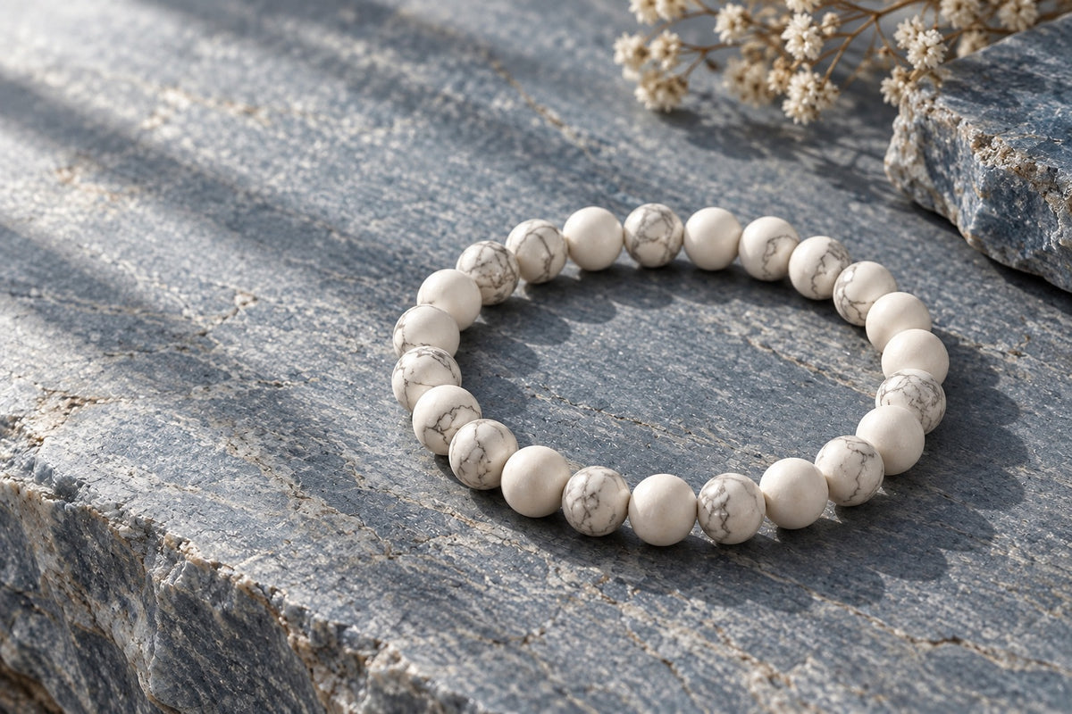 White howlite bead bracelet on grey stone