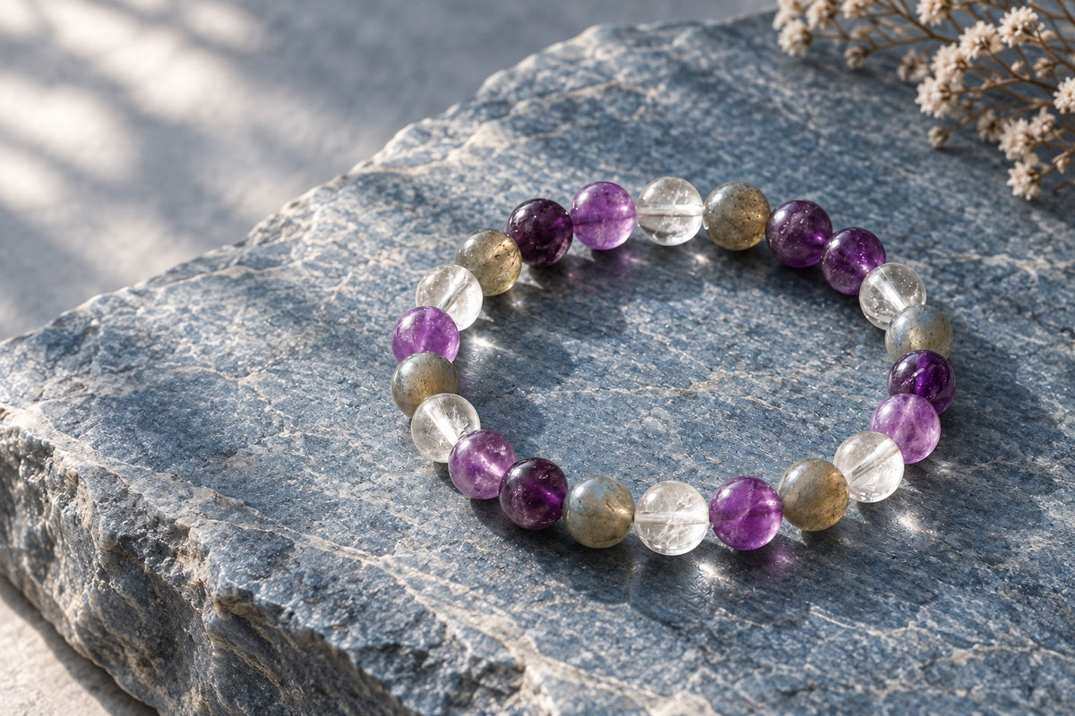 Amethyst, clear quartz and labradorite bracelet on grey stone for Mulank 7